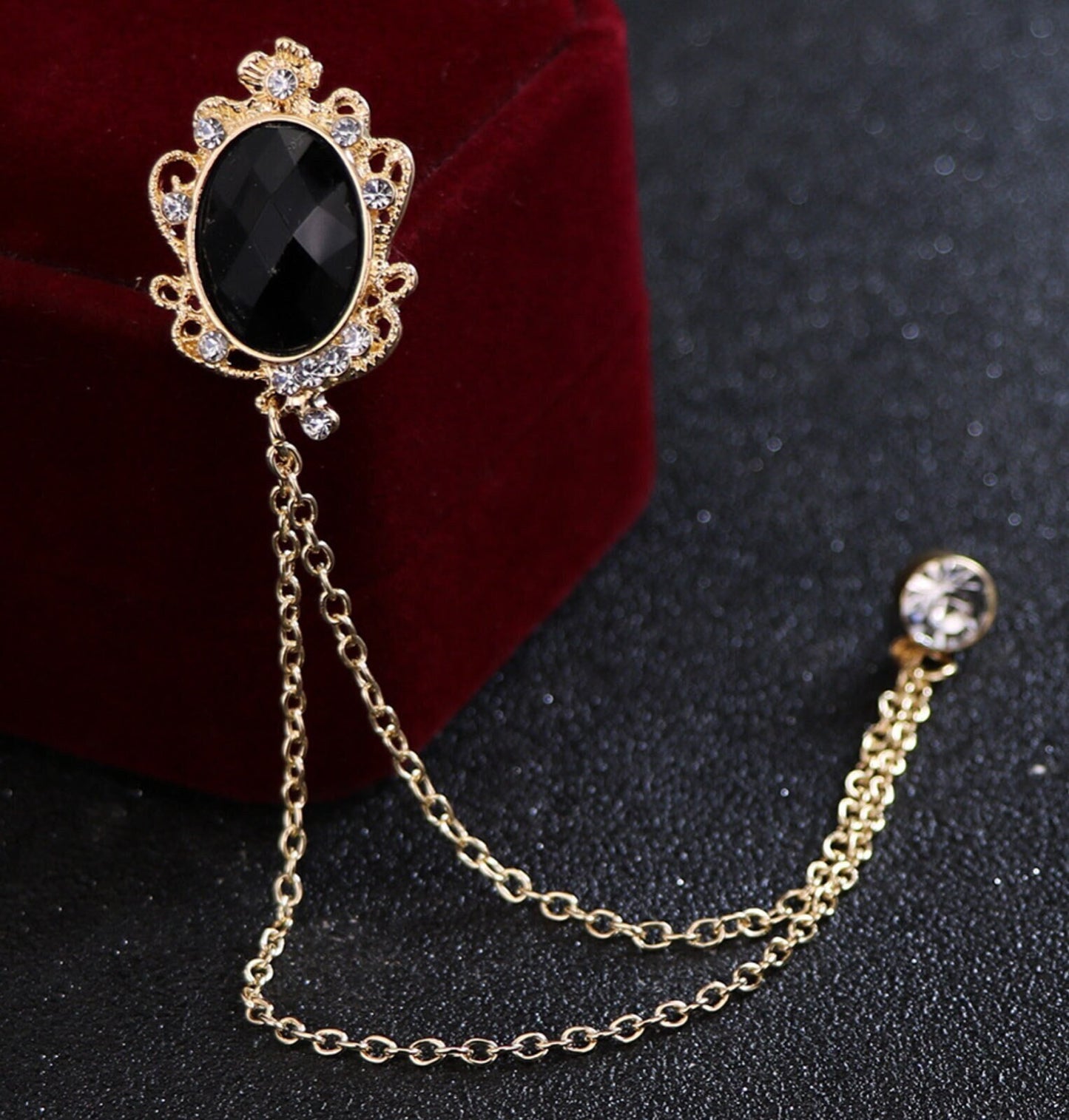 Celebrity brooch stunning gold plated vintage look blue or black stone pin ggg66
