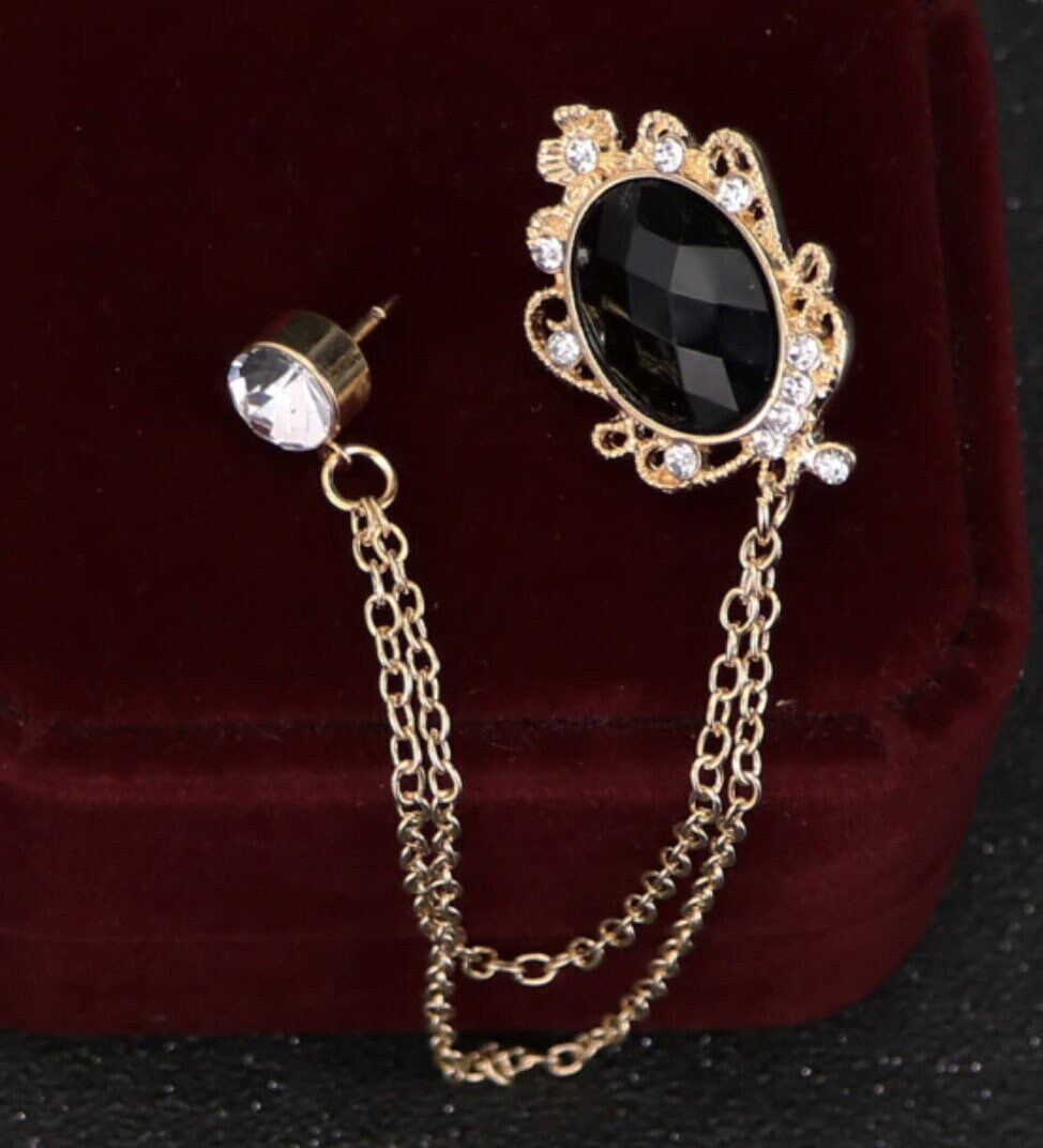Celebrity brooch stunning gold plated vintage look blue or black stone pin ggg66